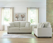 Greenbriar living room set by Ashley Furniture, includes sofa and armchair in green upholstery with wooden legs.
