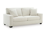 Ashley Furniture Greenbriar living room set with sofa and armchair, featuring green upholstery and contemporary design.