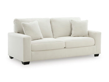 Ashley Furniture Greenbriar living room set with sofa and armchair, featuring green upholstery and contemporary design.