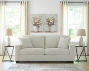 Greenbriar Ashley Furniture living room set with sofa, loveseat, and armchair in neutral upholstery, arranged in a cozy living room scene.
