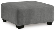 Ashley Furniture Birkdale Court oversized accent ottoman with plush fabric and square shape, shown from an angled view.