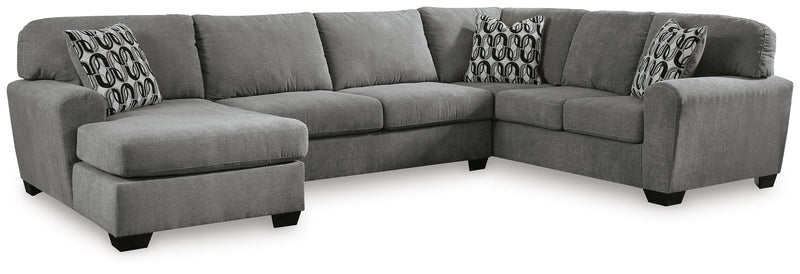 Ashley Furniture Birkdale Court sectional with chaise, featuring plush cushions and a modern design in a cozy living room setting.