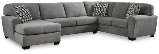 Ashley Furniture Birkdale Court sectional with chaise, featuring plush cushions and a modern design in a cozy living room setting.