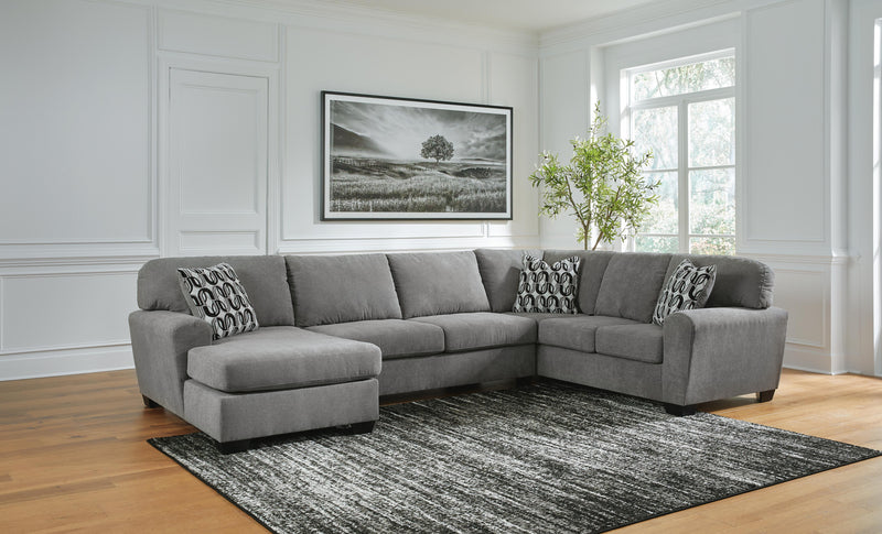 Ashley Furniture Birkdale Court sectional with chaise, featuring plush cushions and modern design in a living room setting.