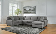 Ashley Furniture Birkdale Court sectional with chaise, featuring plush cushions and modern design, shown in a stylish living room setting.
