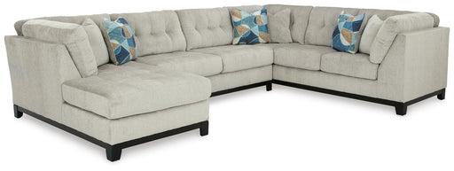 Ashley Furniture Maxon Place sectional with chaise, featuring plush upholstery and modern design in a spacious living room setting.
