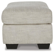 Ashley Furniture Vayda living room set with sofa and armchair in neutral fabric and modern design, shown in a stylish living space.