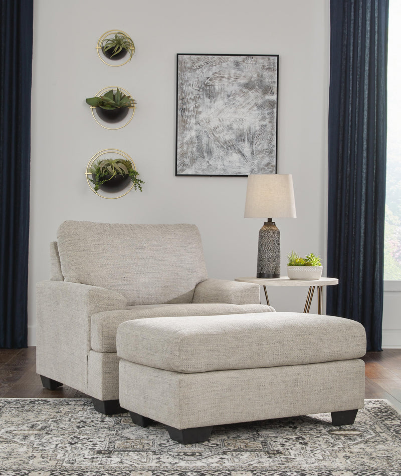 Ashley Furniture Vayda living room set with sofa and armchair in a modern design, featuring neutral upholstery and clean lines.
