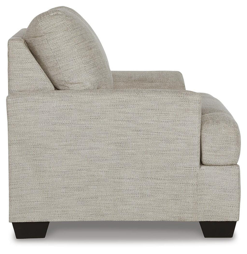 Ashley Furniture Vayda living room set with sofa and armchair in a modern design, featuring neutral fabric upholstery.
