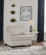 Ashley Furniture Vayda living room set with sofa and loveseat, featuring plush cushions and modern design in neutral tones.