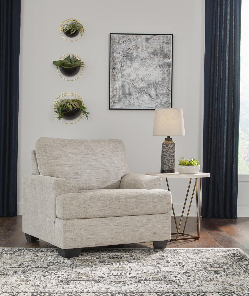 Ashley Furniture Vayda living room set with sofa and loveseat, featuring plush cushions and modern design in neutral tones.
