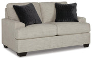 Ashley Furniture Vayda living room set featuring a sofa and loveseat in a modern design, shown from an angled view.