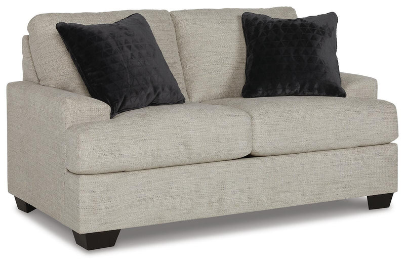 Ashley Furniture Vayda living room set featuring a sofa and loveseat in a modern design, shown from an angled view.