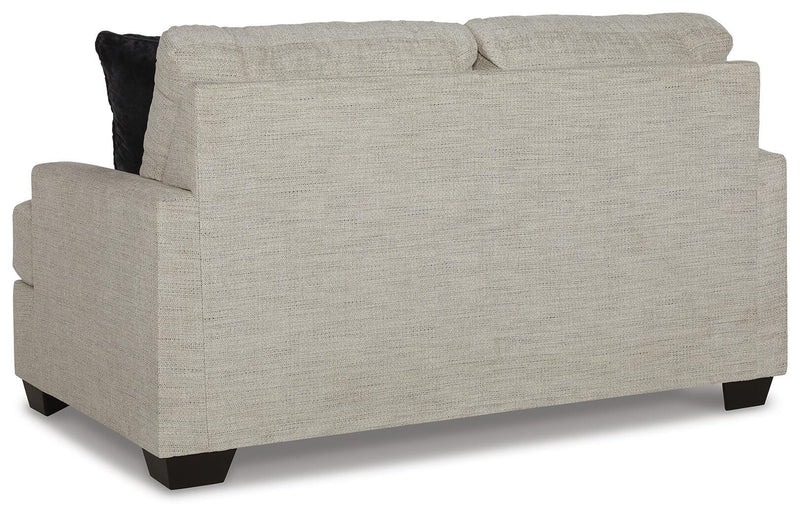 Ashley Furniture Vayda living room set with sofa and armchair, featuring neutral fabric and modern design.