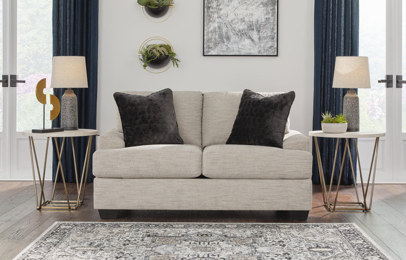 Ashley Furniture Vayda living room set with sofa and armchair in a modern design, featuring neutral fabric upholstery.