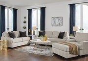 Ashley Furniture Vayda Living Room Set with sofa and armchair featuring neutral fabric and modern design.