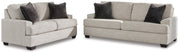 Ashley Furniture Vayda living room set with sofa and armchair in a modern design, featuring neutral fabric upholstery.
