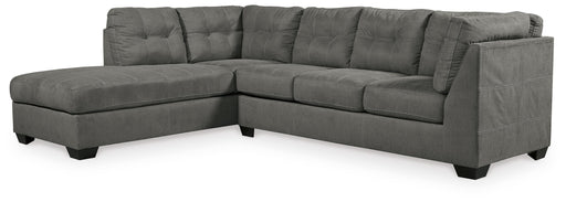 Ashley Furniture Pitkin 2-piece sectional with chaise showing plush fabric upholstery and modern design in a spacious living room setting.