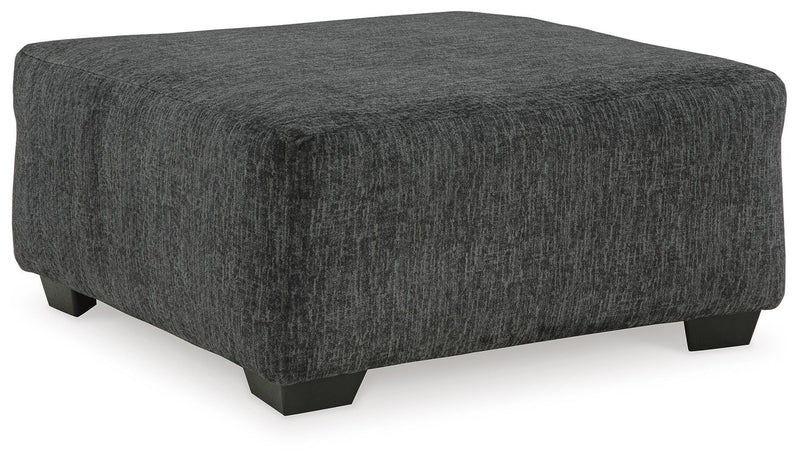 Ashley Furniture Biddeford living room set with a sofa and loveseat, shown from an angled perspective in a modern living space.