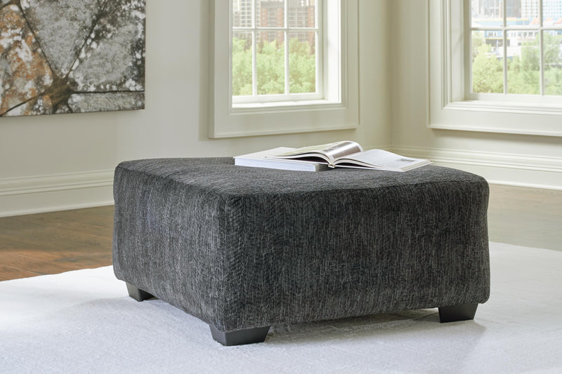 Ashley Furniture Biddeford living room set with sofa and armchair in a modern design, featuring neutral upholstery and plush cushions.