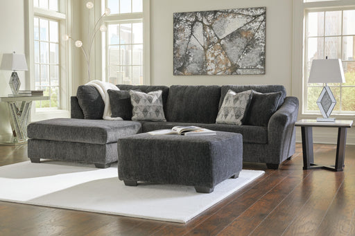 Ashley Furniture Biddeford living room set with beige upholstered sofa and matching armchair in a modern living space.