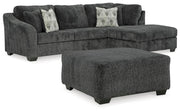 Ashley Furniture Biddeford living room set with sofa and loveseat featuring neutral fabric and plush cushions.