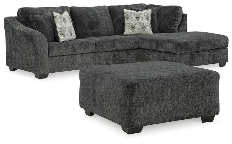 Ashley Furniture Biddeford living room set with sofa and loveseat featuring neutral fabric and plush cushions.