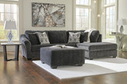 Ashley Furniture Biddeford living room set with plush sofa and coordinating armchair in neutral upholstery.