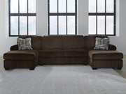 Ashley Furniture Kimlee sectional with double chaise, showing a modern fabric sectional sofa with multiple seating sections and a double chaise.