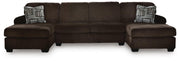 Ashley Furniture Kimlee sectional with double chaise, featuring plush cushions and modern design in a spacious living room setting.