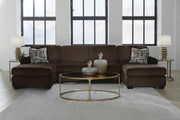 Ashley Furniture Kimlee sectional with double chaise, featuring plush cushions and modern design in a spacious living room setting.