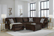 Ashley Furniture Kimlee sectional with chaise, featuring plush fabric upholstery and a modern design in a spacious living room setting.