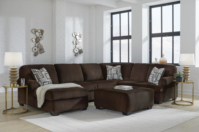 Ashley Furniture Kimlee sectional with chaise, featuring plush fabric upholstery and a modern design in a spacious living room setting.