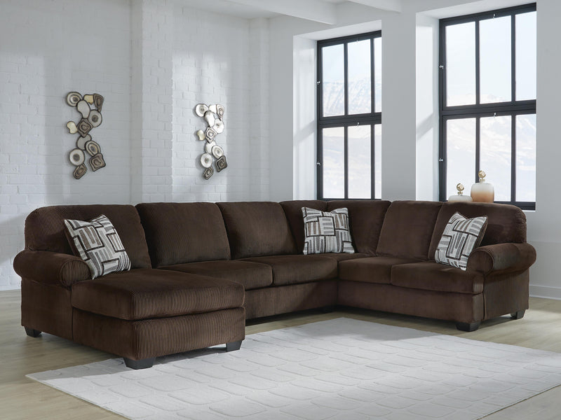 Ashley Furniture Kimlee sectional with chaise in a modern fabric, featuring plush cushions and a spacious seating arrangement.