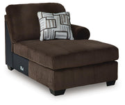 Ashley Furniture Kimlee sectional with chaise, showing a modern fabric sectional sofa with plush cushions and a spacious chaise lounge.