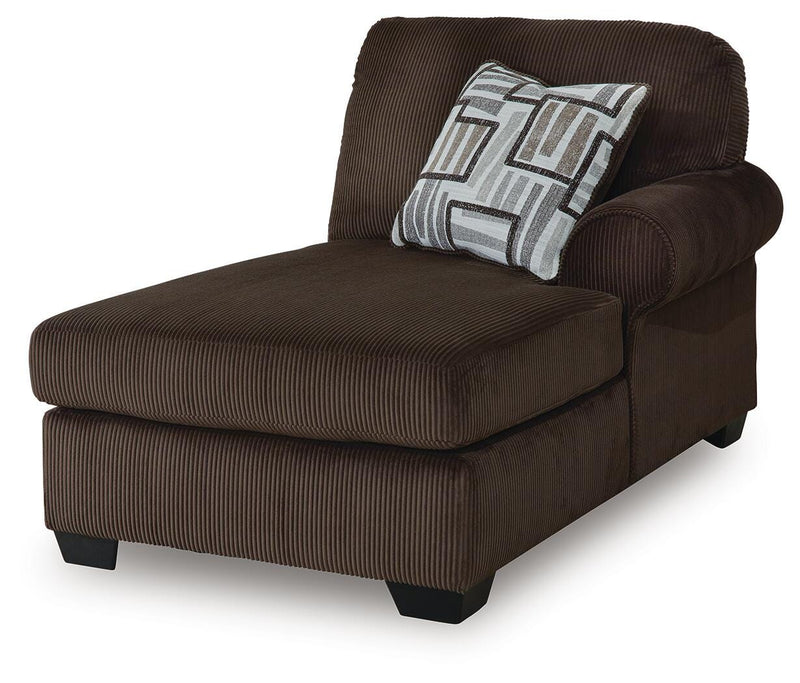 Ashley Furniture Kimlee sectional with chaise, showing a modern fabric sofa with plush cushions and a spacious chaise lounge.