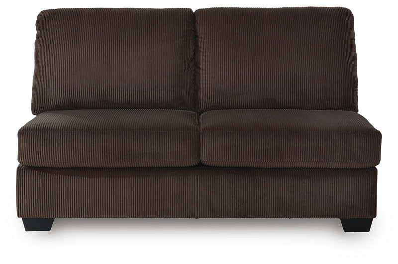 Ashley Furniture Kimlee sectional with chaise, beige fabric, plush cushions, and modern design, shown from a head-on angle.