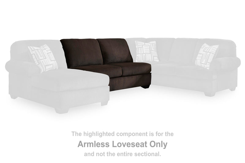 Ashley Furniture Kimlee sectional with chaise, featuring plush cushions and modern design in a neutral fabric.