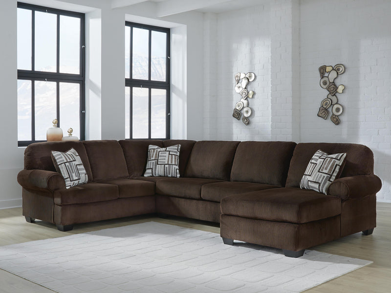 Ashley Furniture Kimlee sectional with chaise, showing a modern fabric sectional sofa with a built-in chaise lounge and plush cushions.