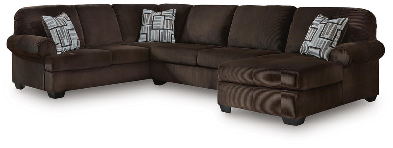 Ashley Furniture Kimlee sectional with chaise, featuring plush fabric upholstery and a modern design in a neutral color.