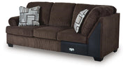 Ashley Furniture Kimlee sectional with chaise, showing a modern fabric sofa with a comfortable chaise lounge in a living room setting.