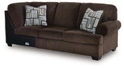 Ashley Furniture Kimlee sectional with chaise, featuring plush upholstery and a modern L-shape design, shown from an angled view.