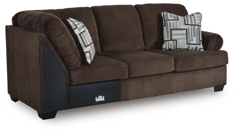 Ashley Furniture Kimlee sectional with chaise, featuring plush upholstery and a modern L-shaped design, shown from an angle.