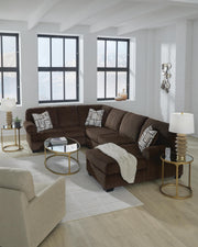 Ashley Furniture Kimlee sectional with chaise, showing a modern fabric sofa with plush cushions and a spacious design.