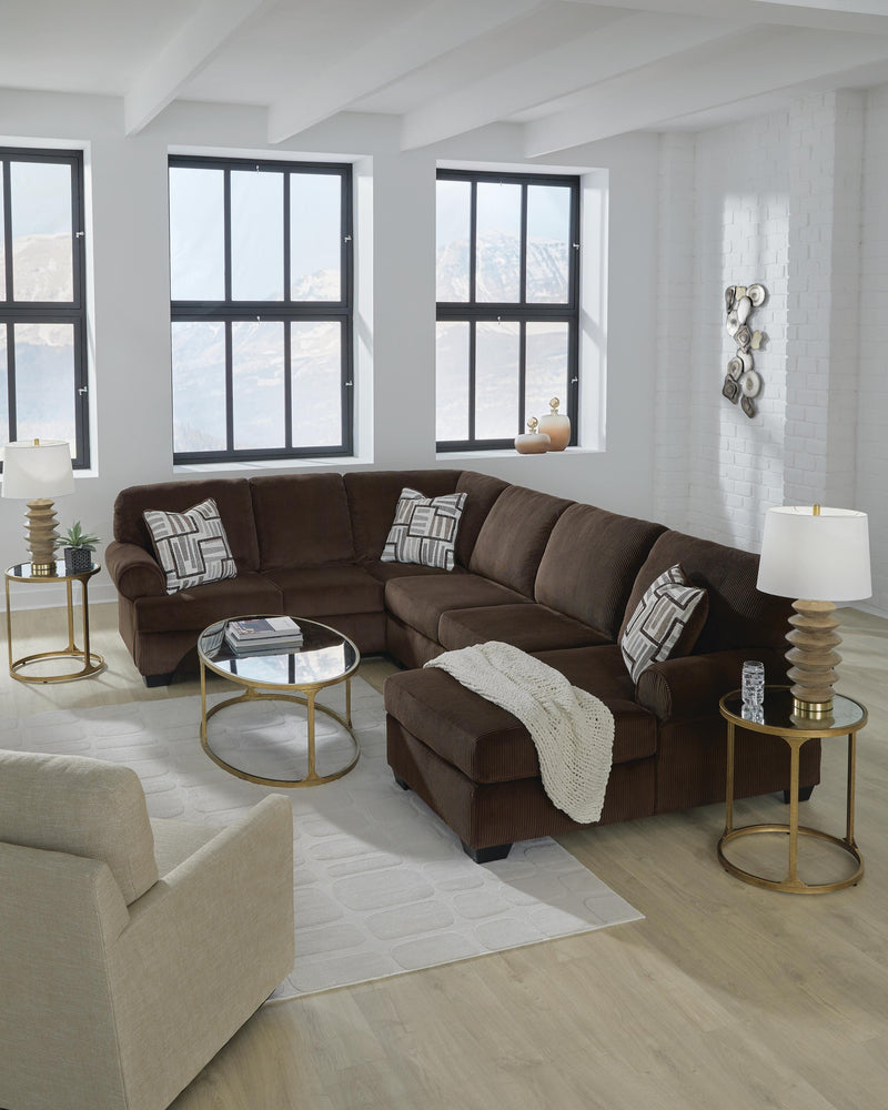 Ashley Furniture Kimlee sectional with chaise, showing a modern fabric sofa with plush cushions and a spacious design.