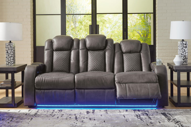 Ashley Furniture Fyne-Dyme Power Reclining Sofa in open position, with plush cushions and reclining mechanism visible.