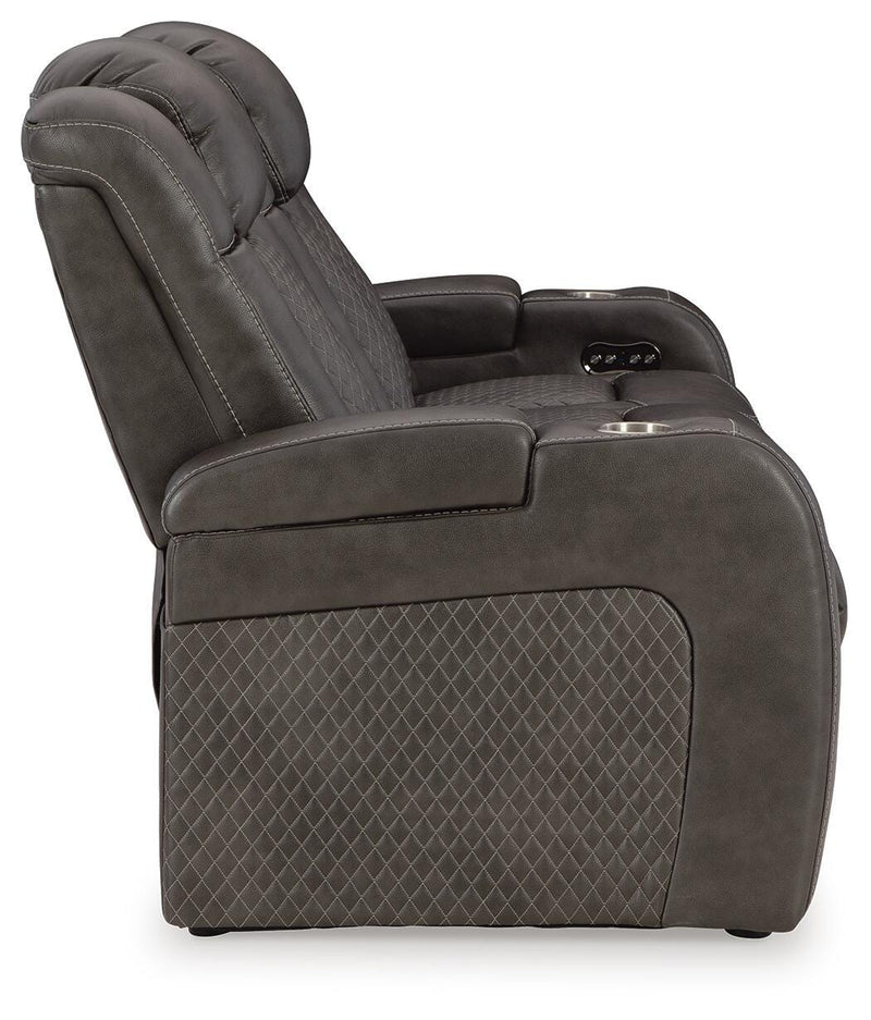 Ashley Furniture Fyne-Dyme Power Reclining Sofa with plush fabric and multiple reclining seats, shown from a side view.