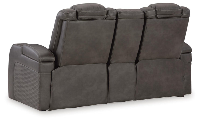 Ashley Furniture Fyne-Dyme power reclining loveseat with console, showing plush upholstery and built-in cup holders.