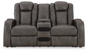 Ashley Furniture Fyne-Dyme Power Reclining Loveseat with console, showing plush fabric, reclining feature, and built-in cup holders.