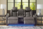 Ashley Furniture Fyne-Dyme power reclining loveseat with console, featuring plush cushions and built-in cup holders.